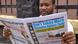 Newspaper reader in Liberia