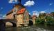 The bridge leading to the island in the river where the historical Town Hall building is located in Bamberg, Bavaria