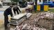 Workers clean up the site where the oldest statue of King Leopold II in Belgium was removed Tuesday. 